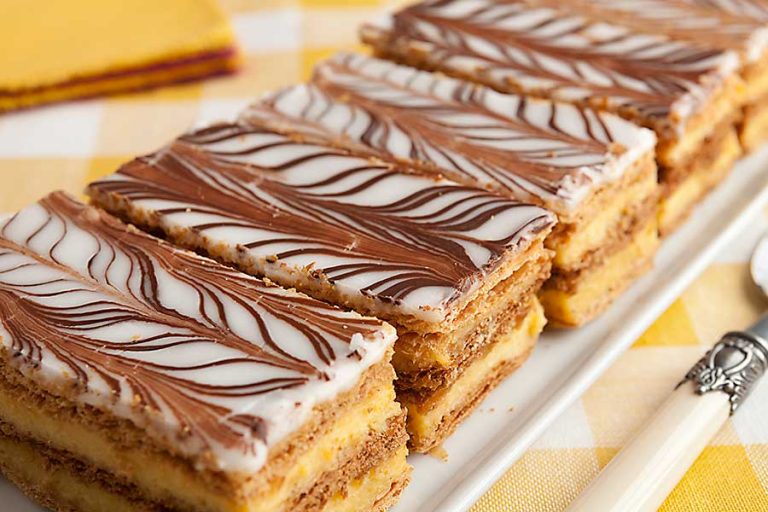 Mille-feuille is a three layers of French pastry dipped in vanilla cream.