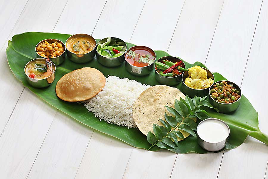 Meals served on banana leaf, traditional south Indian cuisine