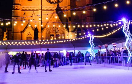 SYDNEY, AUSTRALIA - JULY 1, 2017: People ice skating outdoor in front of St Marys cathedral for Sydney Winter Festival