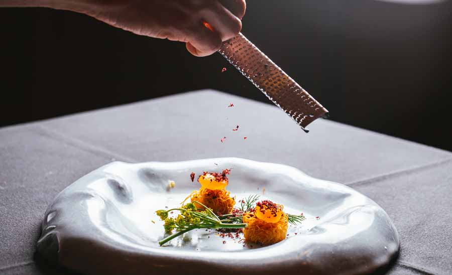 Chef Robert Morales Birds-nest canapé of kataifi pastry, dill flowers, a week cured egg yolk