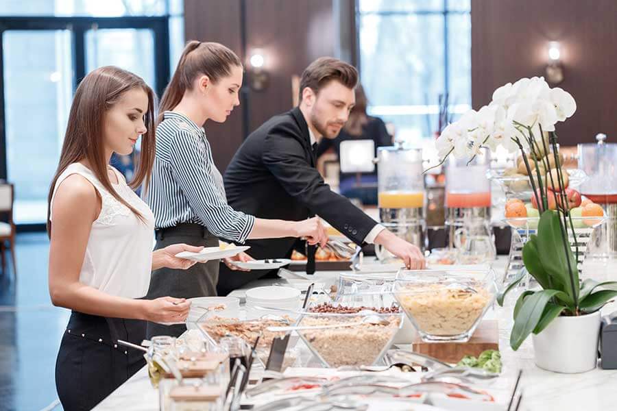 office staff enjoying a breakfast buffet