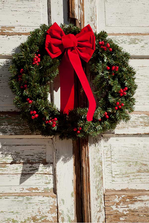 Christmas wreath hab=nging on the door