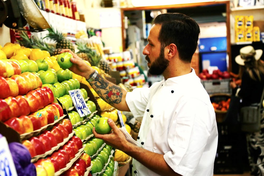 Chef in the veggie shop selecting ingrediends for the canapes