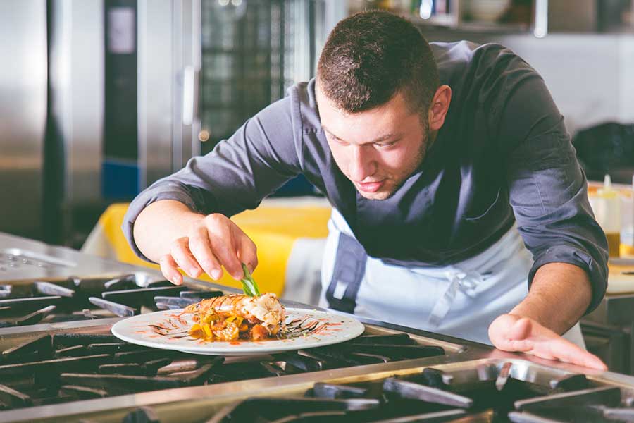 Chef is plating a dish