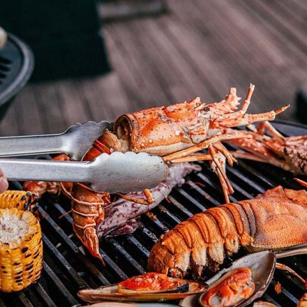 Lobster and mix seafood barbecue cooking on grill