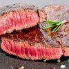 Summer bbq medium rare beef flank steak with sea salt and rosemary