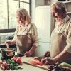 Old couple in kitchen cooking together