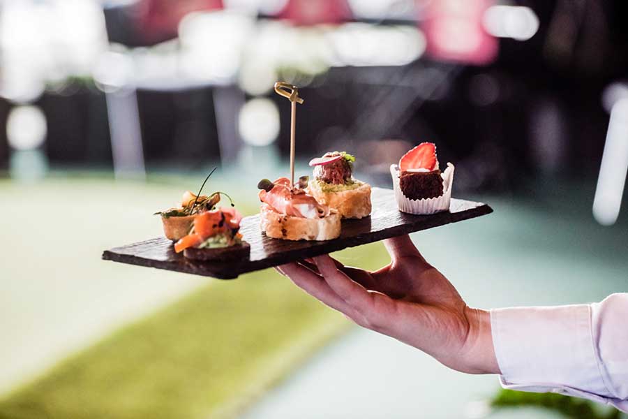 canapés carried by a waiter