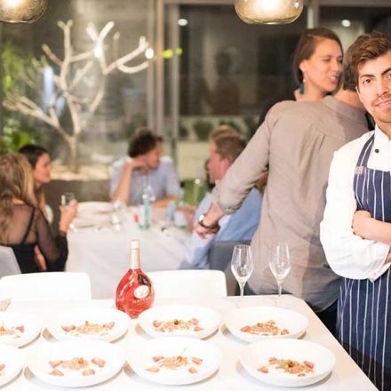 chef Robert Morales in front of a dinner group