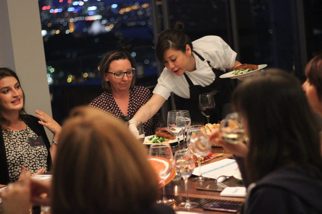 Chef Sasha serving a group of ladies