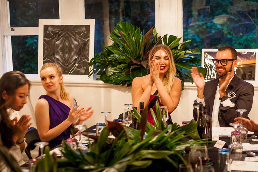 Happy guests at the table during the event delivered by private chef in Perth