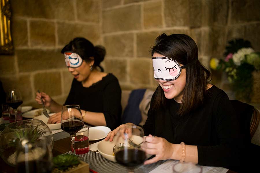 guests enjoying dine in the dark experience