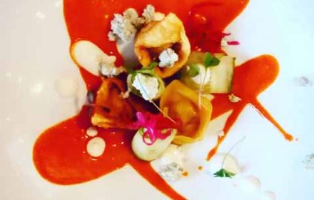 chef christopher norris dish fried buffalo chicken dumpling served with Frank's spicy sauce cucumber ribbins crumble d blue & blue cheese foam