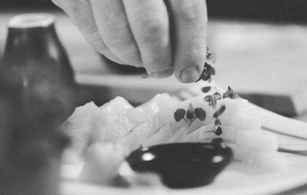 Chef Michael Chatto plating kingfish sashimi deluxe
