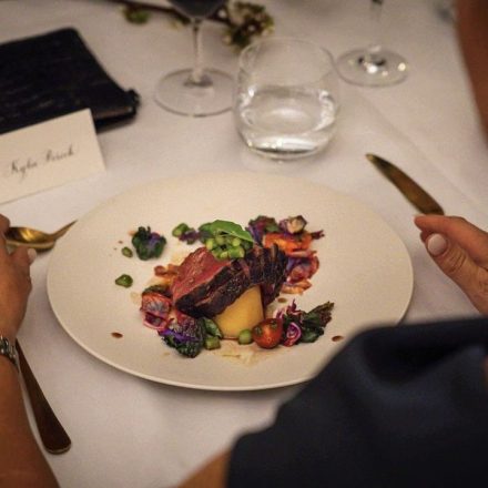a lady is enjoying a fine dining dish from CHEFIN private chef