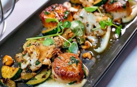 Chef Michael Turkic Grilled Scallop with Marinated Mushrooms and Greens Dish