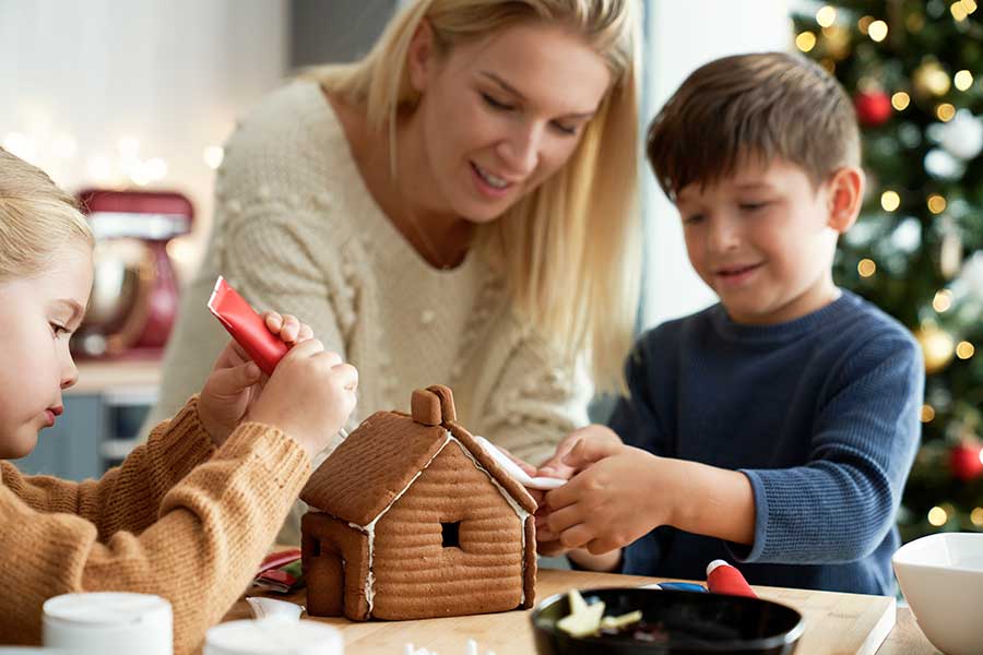 Family making a gingerbread house