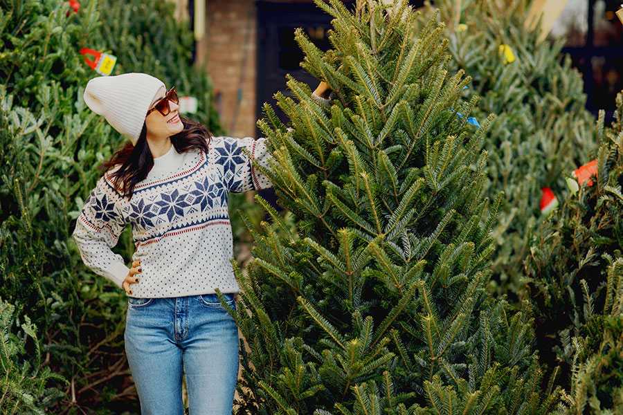 Woman purchasing a real christmas tree