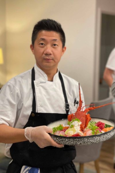 Chent Thant Aung profile photo holding a lobster dish