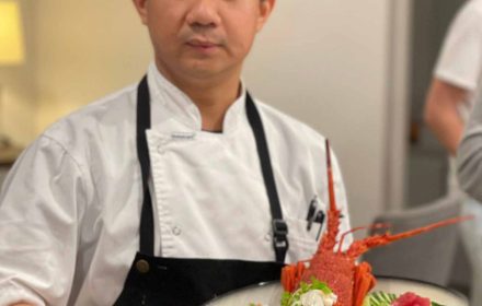 Chent Thant Aung profile photo holding a lobster dish