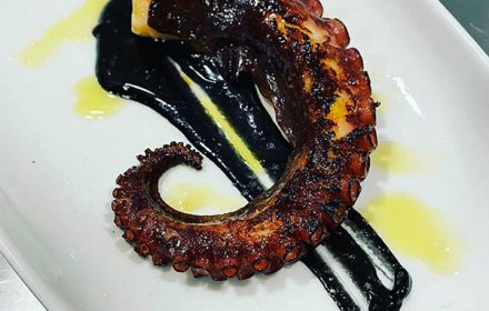 Chef Vedran Perojevic grilled octopus with seafood reduction with cuttlefish