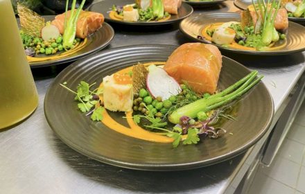 Chef Mani Bharat Poached salmon, fish mousse, lemon butter peas, capers, pickled baby fennel bulb, saffron Bouillabaisse