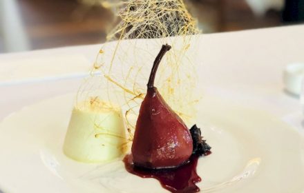 Chef Mani Bharat Red Wine Spiced poached pear, vanilla panacotta, toffee swirl
