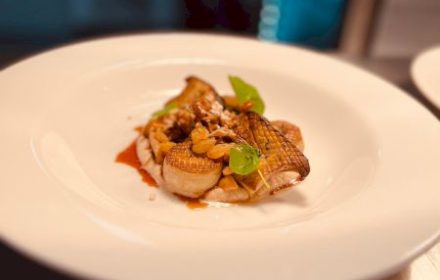 Chef Lyan Shim King brown musroom scallop, roasted cauliflower puree, golden raisin, candied pine nut ,black garlic soy Jus.