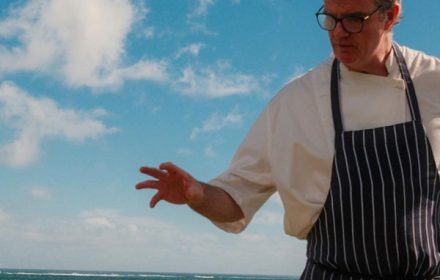 chef tom kime showing his food to audience