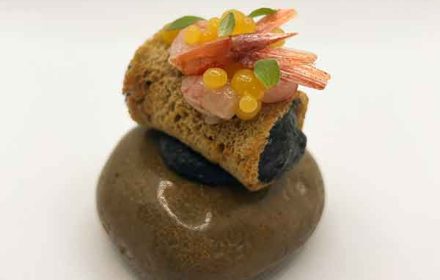 Giuseppe Palminteri Cannolo of bread filled with ricotta and cuttlefish ink, red shrimps and mango perlage