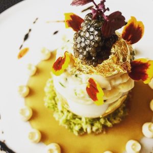 entree dish with gold leaf