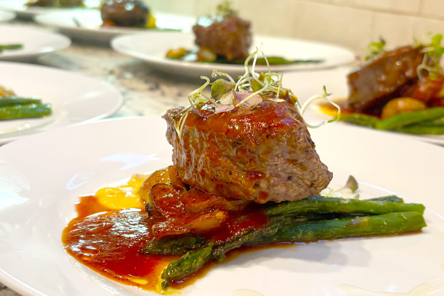 chef Kamal Hoyte grilled fillet with mignon burgundy, pearl onion reduction
