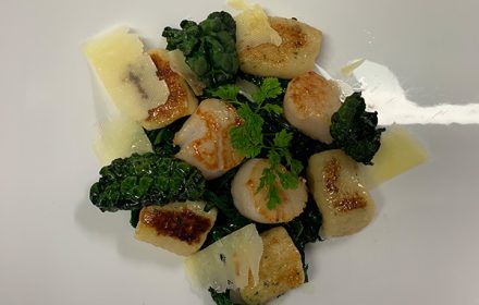 Chef Hao Huang Pa fried gnocchi, scallops, pesto, crispy kale and Parmesan