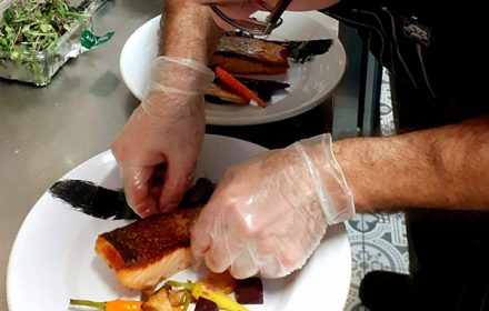 Chef Raffaele de Falco on the stage plating salmon