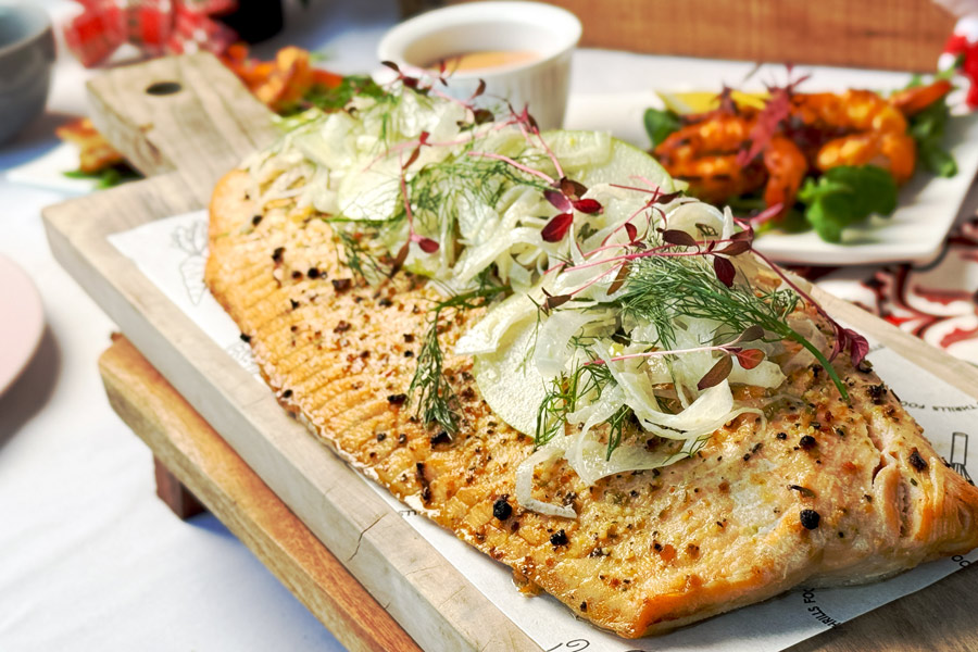 grilled whole side of salmon, apple fennel slaw