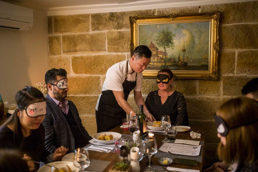 chef winston zhang serving blindfolded guests