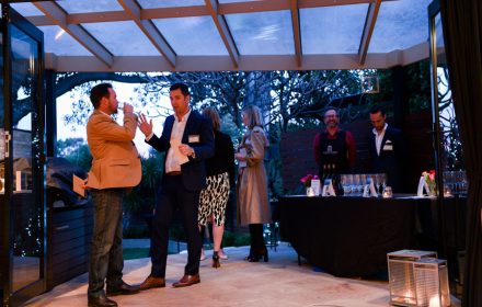 guests chatting at an company cocktail party